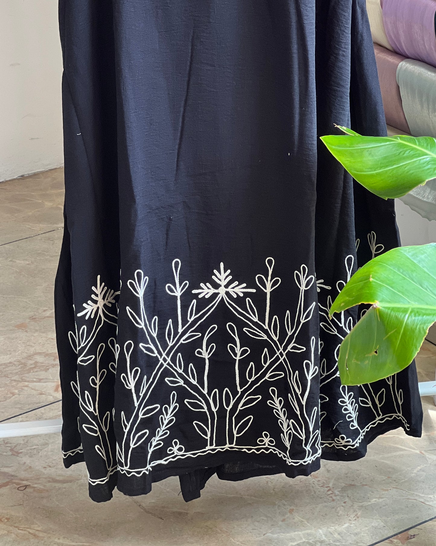 Black embroidered pinafore with off white inner