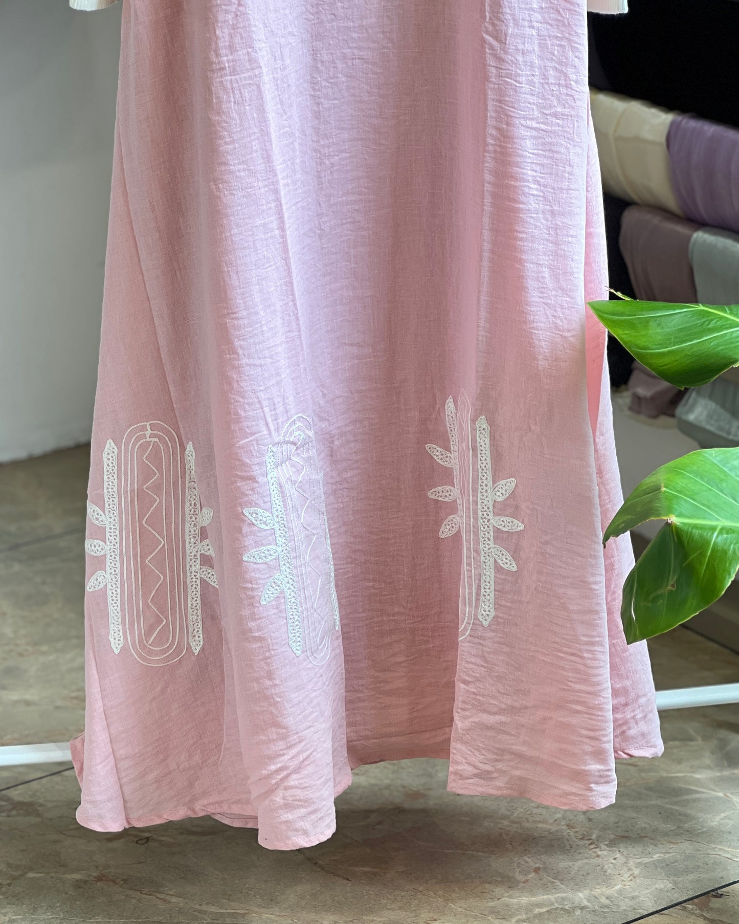 Light pink embroidered pinafore with white inner
