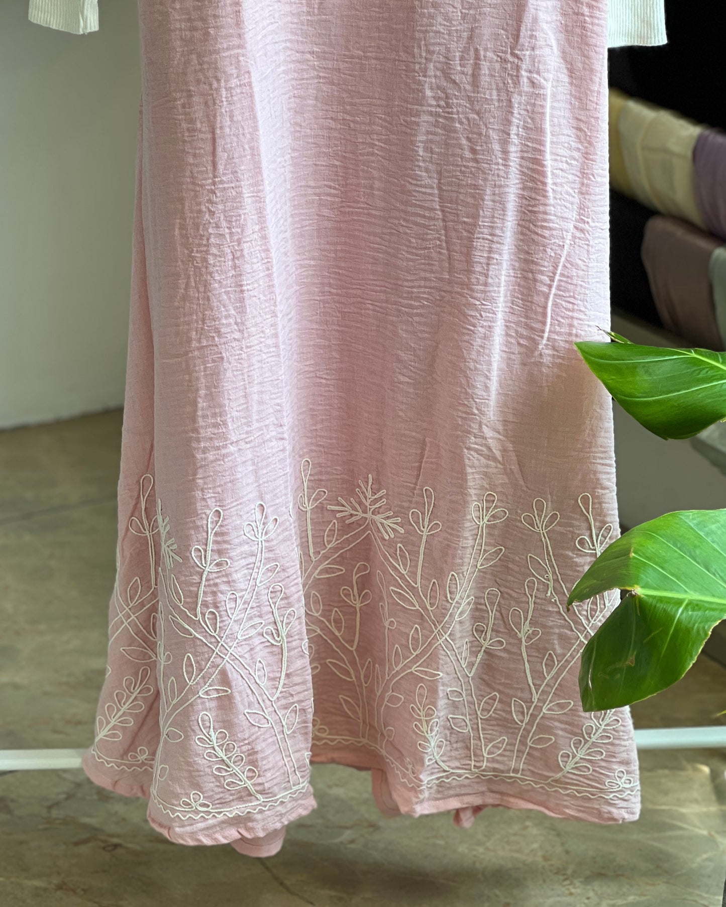 Light pink embroidered pinafore with white inner