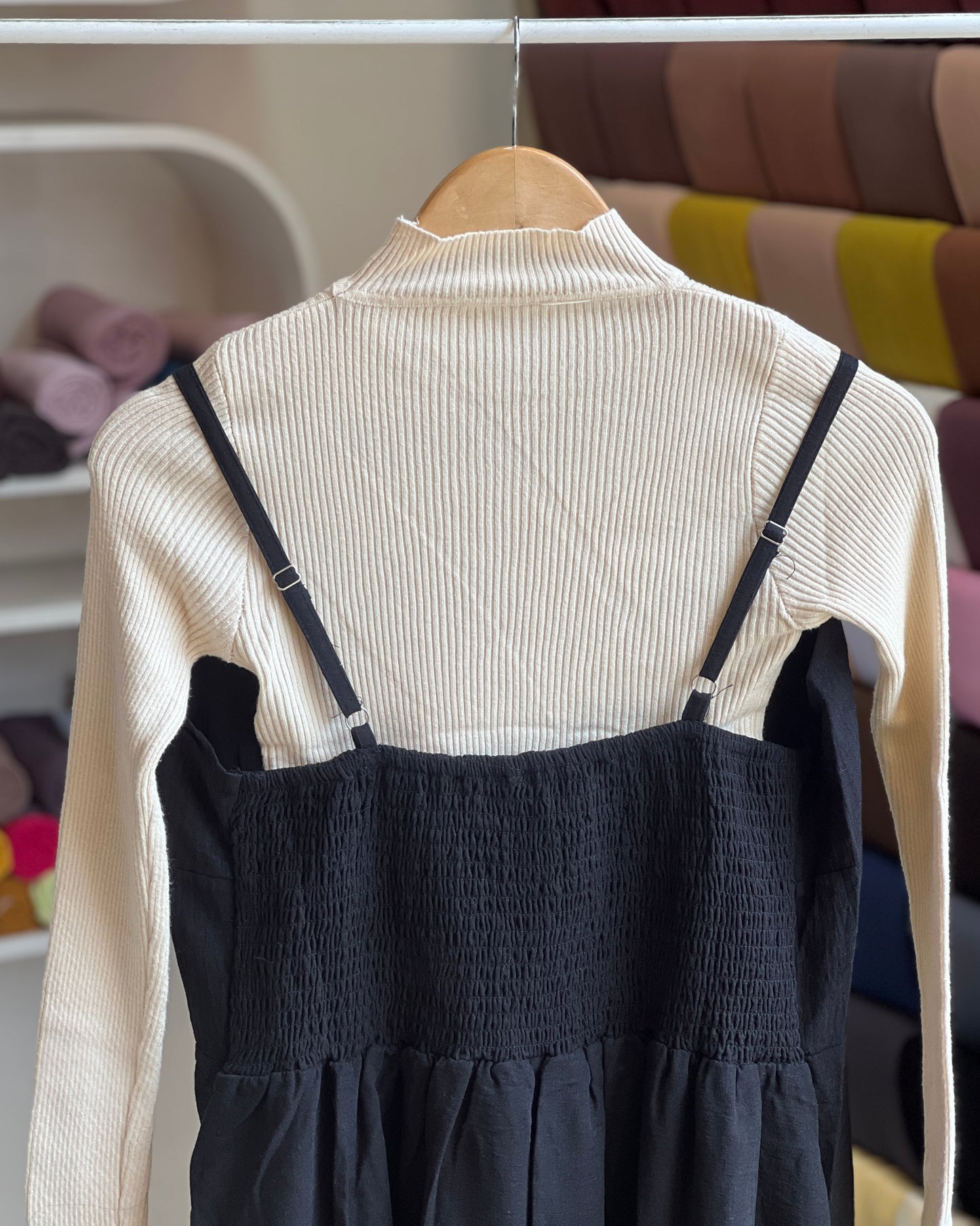 Black embroidered pinafore with off white inner