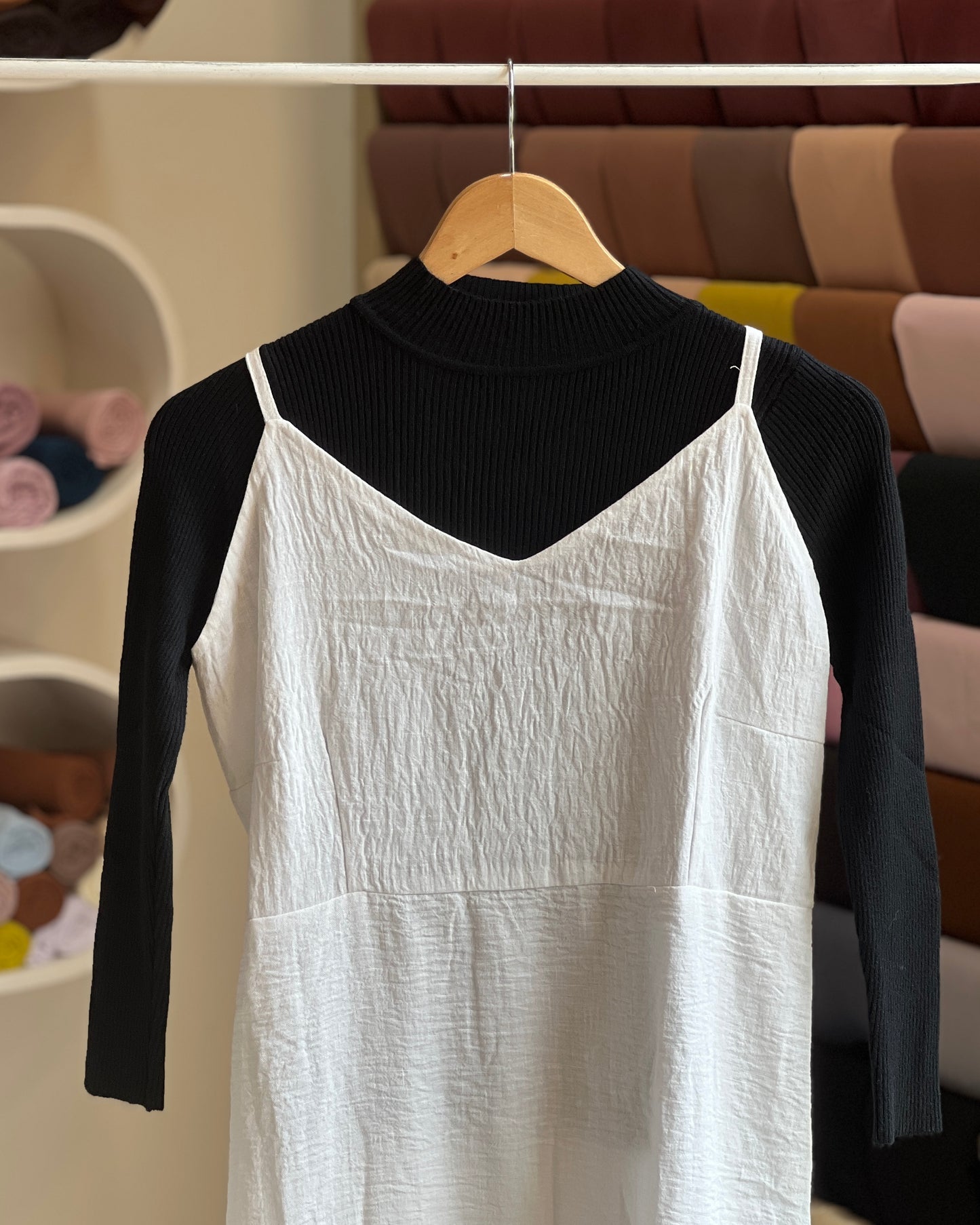 White embroidered pinafore with black inner