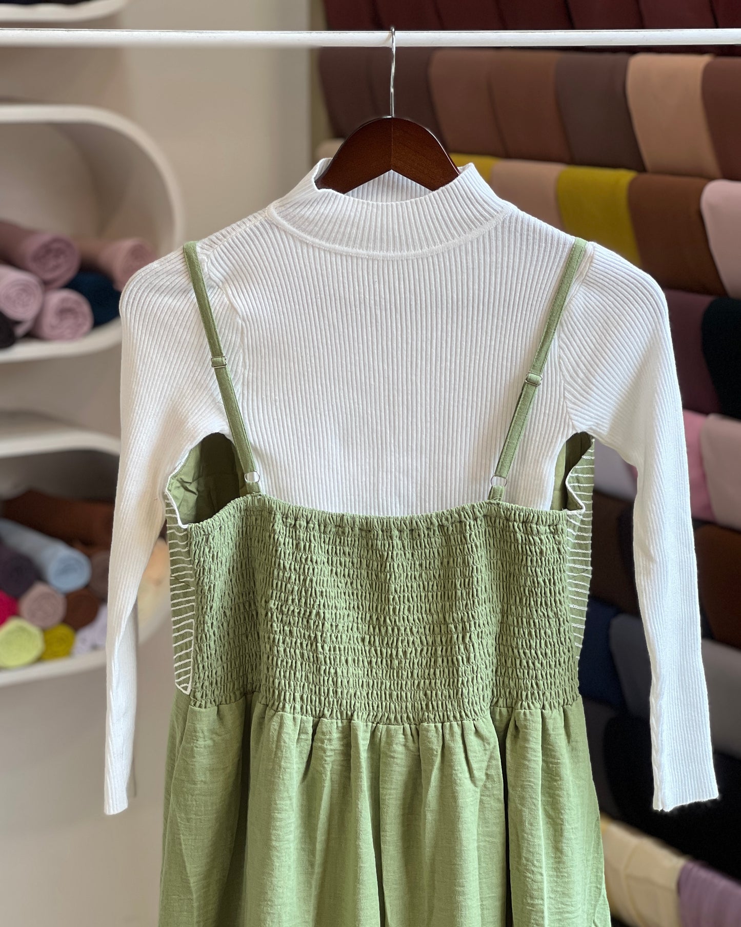Saga green embroidered pinafore with white inner
