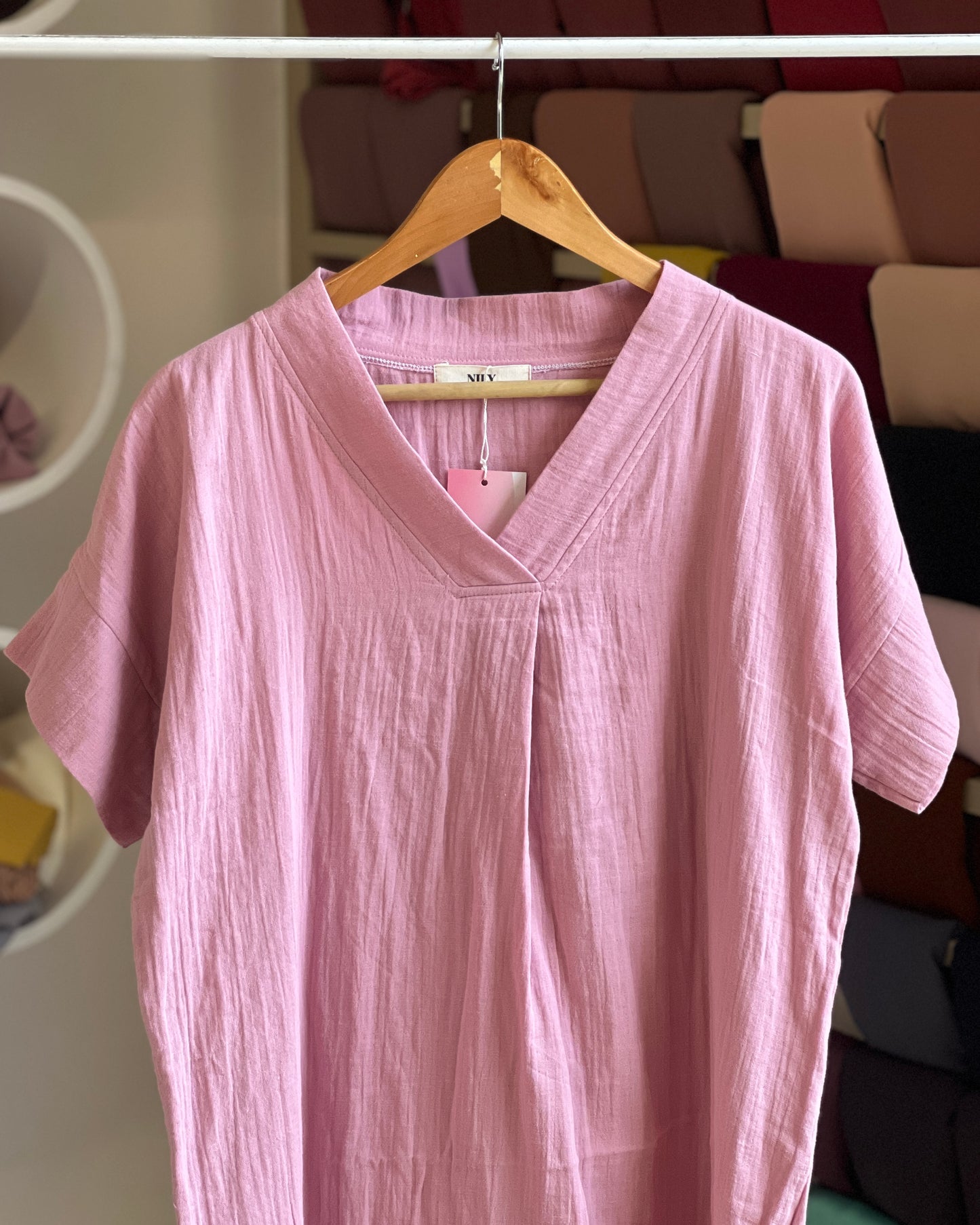 Women’s light pink v-neck tunic top