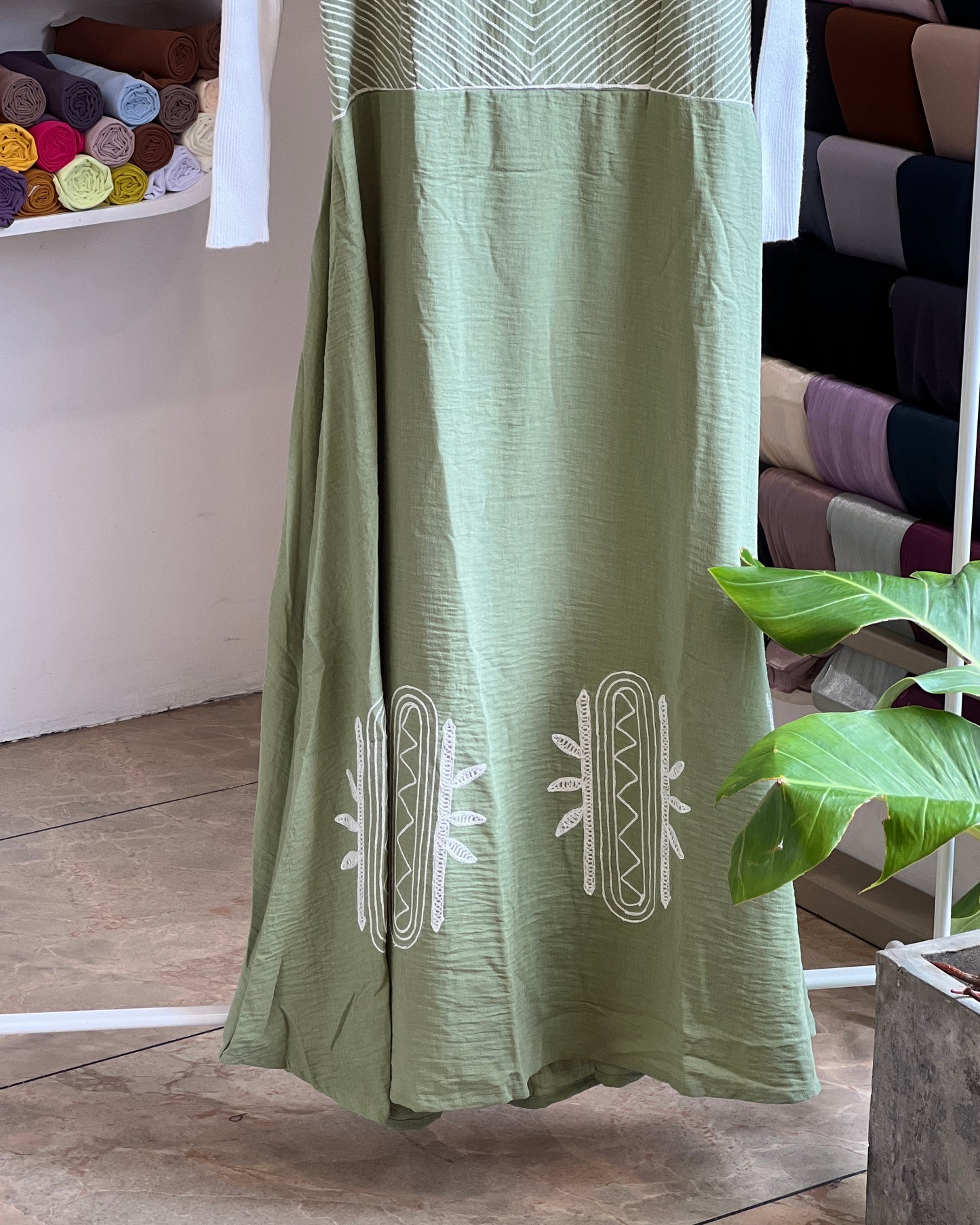 Saga green embroidered pinafore with white inner