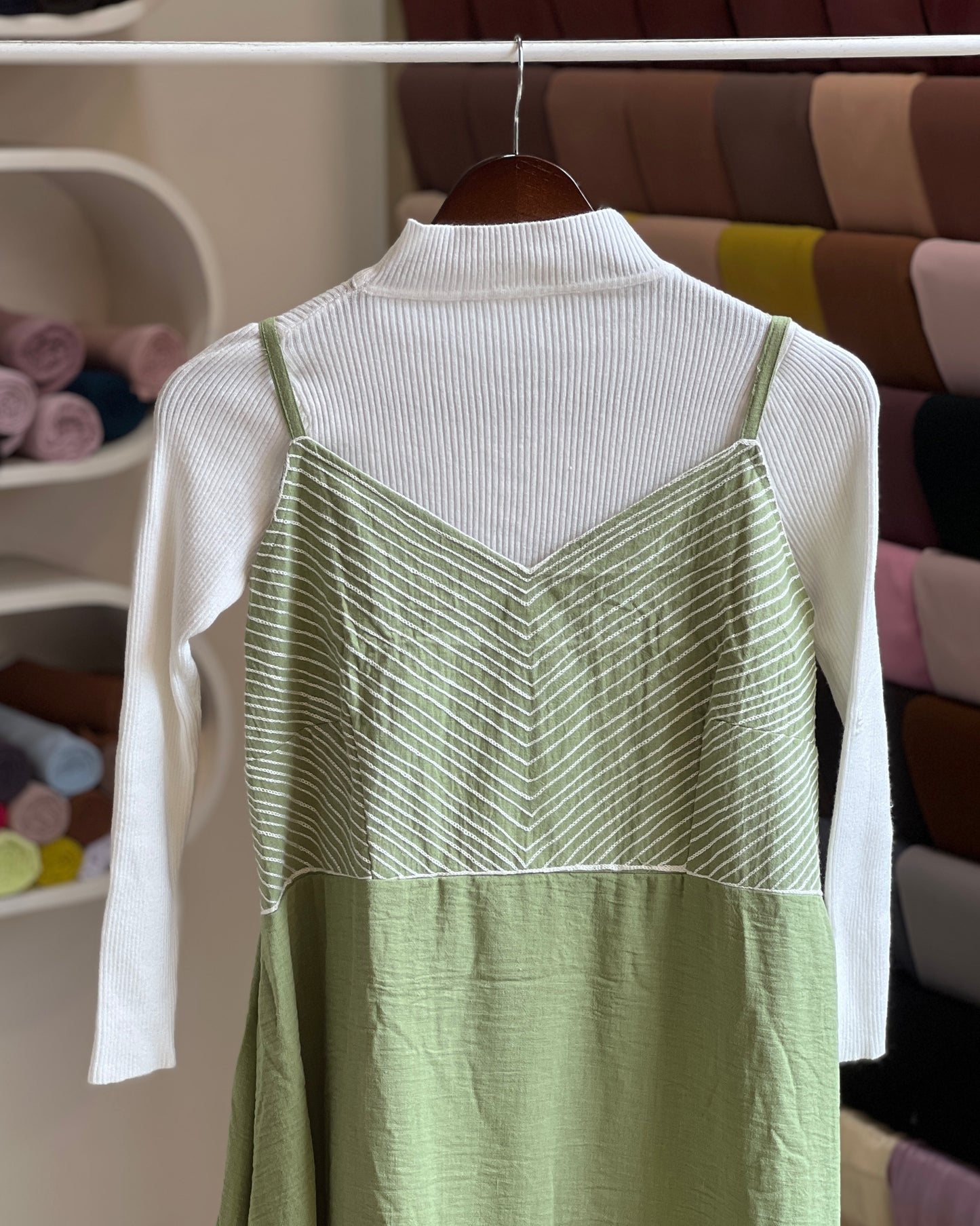 Saga green embroidered pinafore with white inner