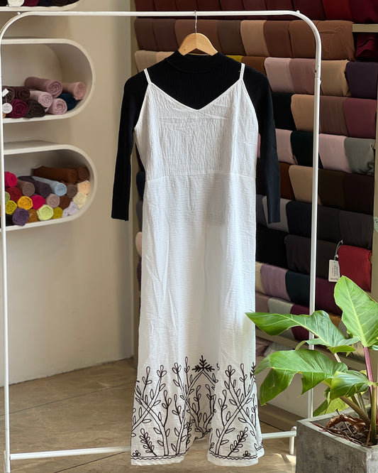 White embroidered pinafore with black inner