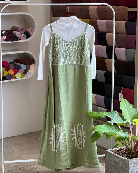 Saga green embroidered pinafore with white inner